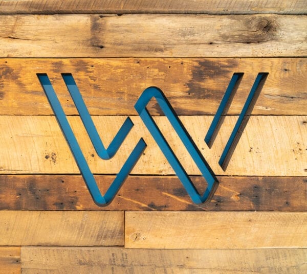 Webb logo on pallet wall