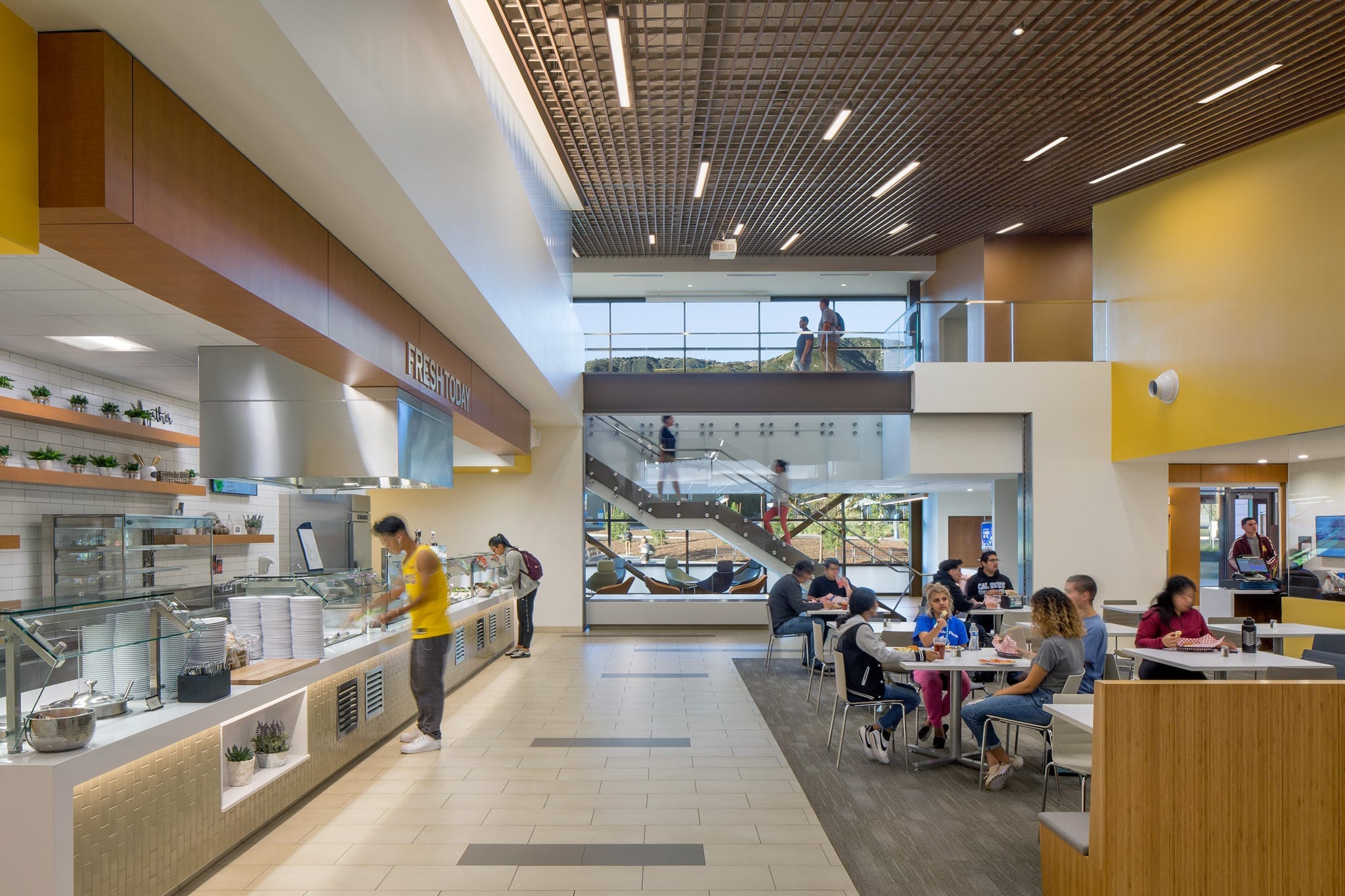 CSU San Bernardino cafeteria with self-serve counter and seating.